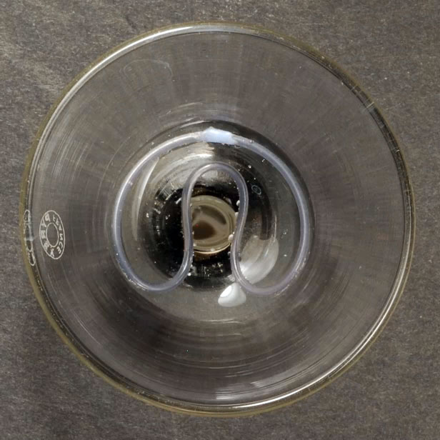 04 A rubber ring passes through a funnel's image